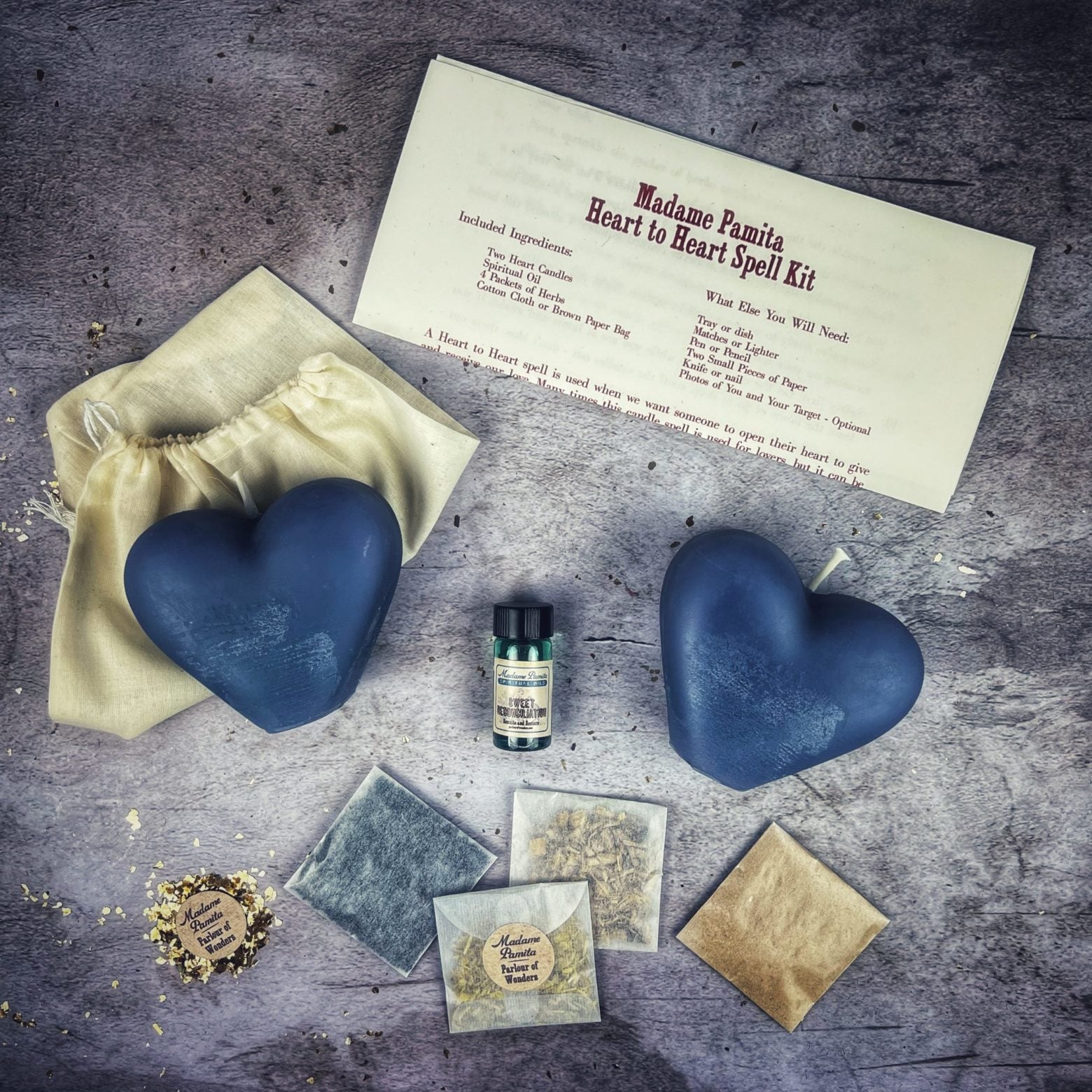 Red Heart to Heart Candle Spell Kit by Parlour of Wonders for love connection and reconciliation magic, featuring candles and ritual tools.