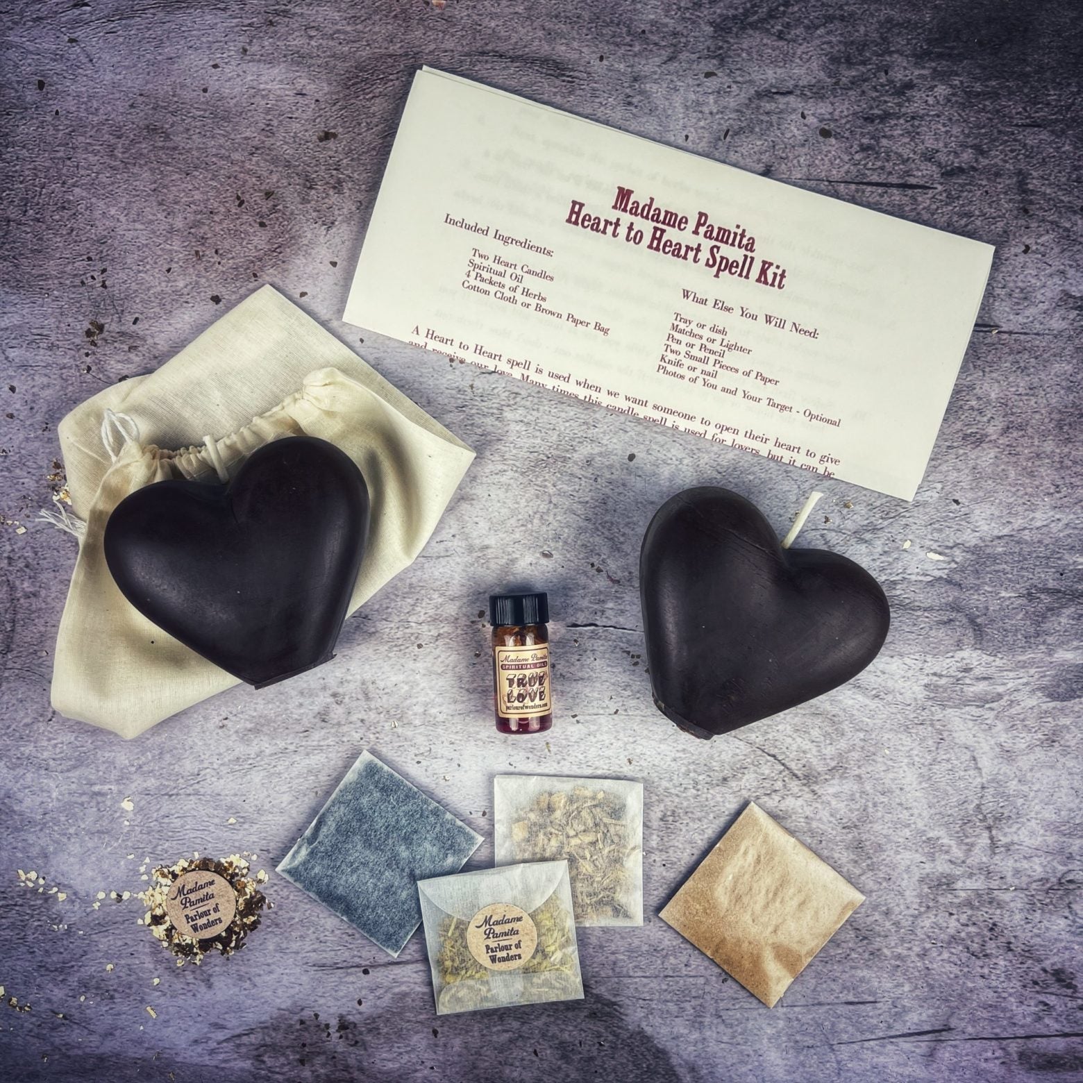 Parlour of Wonders Heart to Heart Candle Spell Kit with red candles and love connection symbols for reconciliation magic.