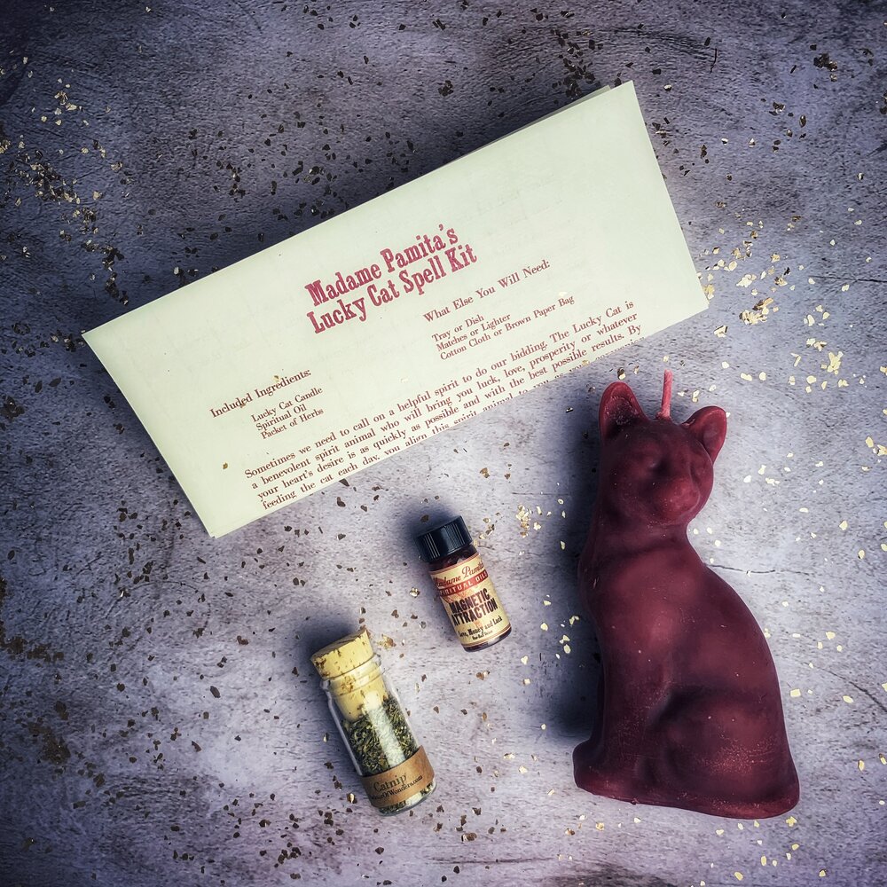 Red Lucky Cat Candle Spell Kit by Parlour of Wonders with candles, herbs, and tools for fast action manifestation magic.