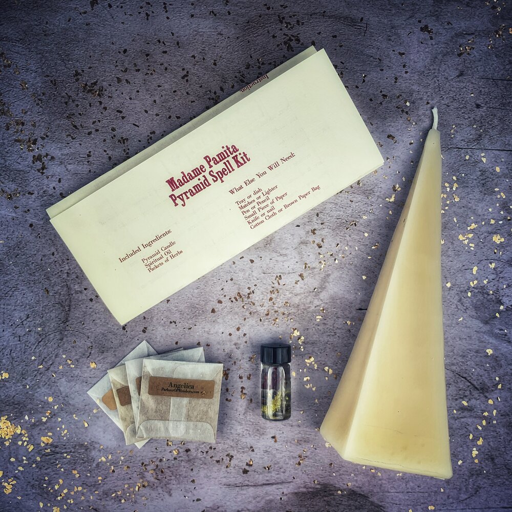 Red Pyramid of Power Candle Spell Kit by Parlour of Wonders featuring candles and ritual tools for success and stability.