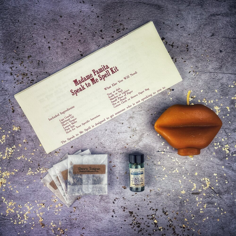 Parlour of Wonders Candle Spell Kit for open communication and reconciliation, featuring red candles and spell tools.