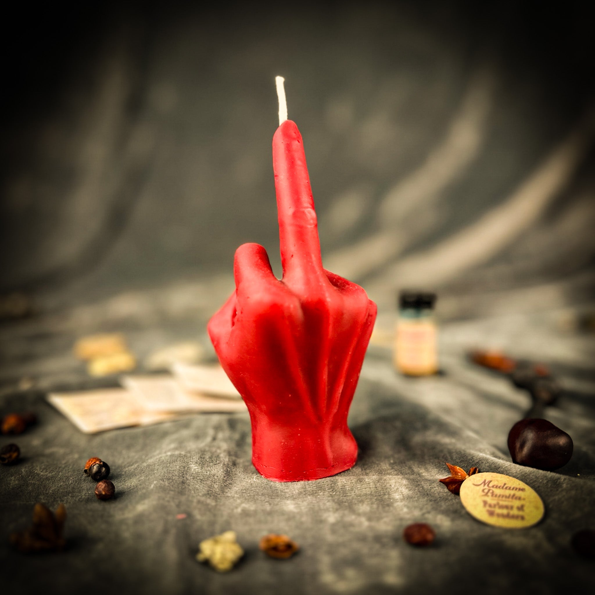 Red Middle Finger Candle Spell Kit by Parlour of Wonders for banishing and empowerment magic, featuring a bold finger-shaped candle.