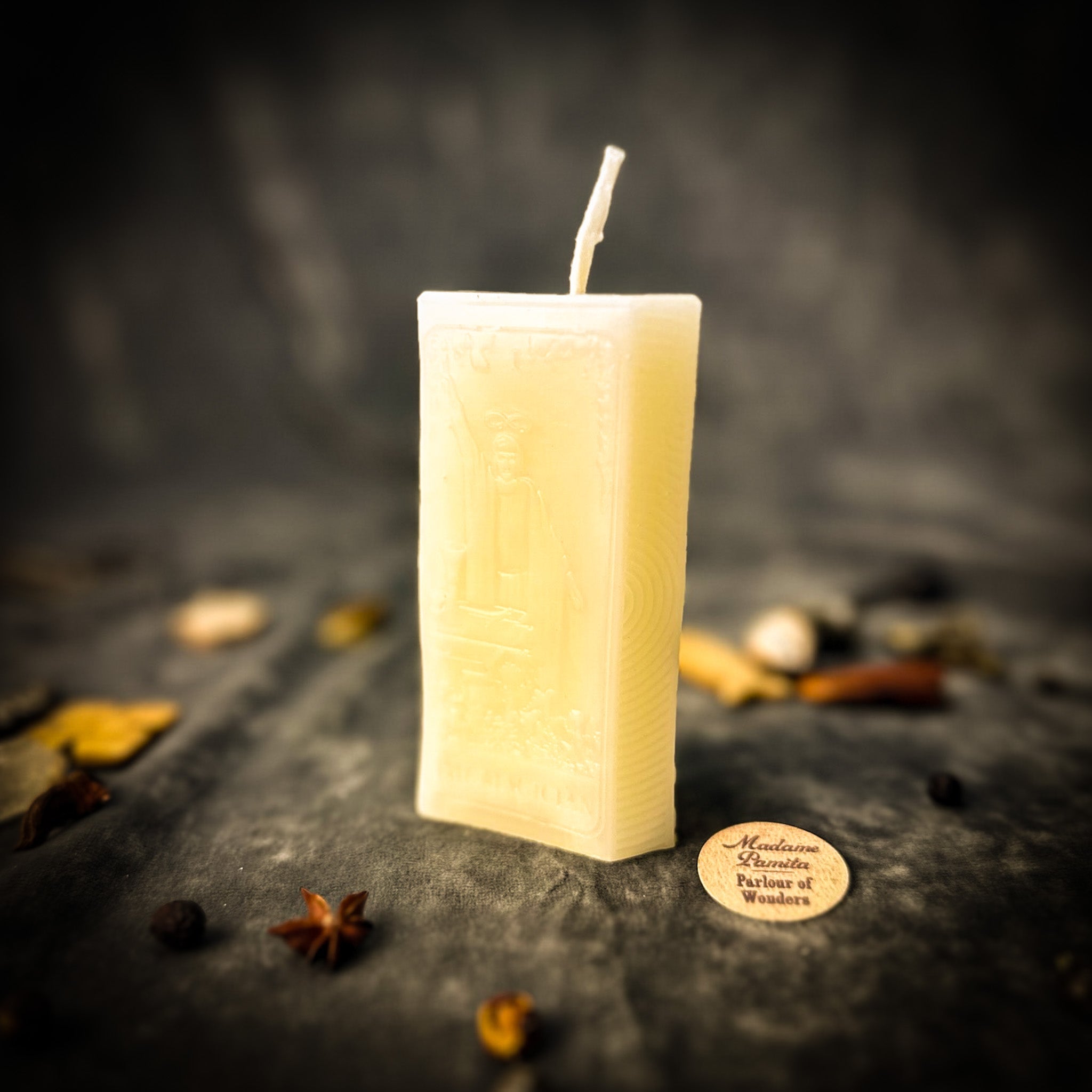 Red candle spell kit from Parlour of Wonders featuring mystical symbols for manifestation and willpower magic.