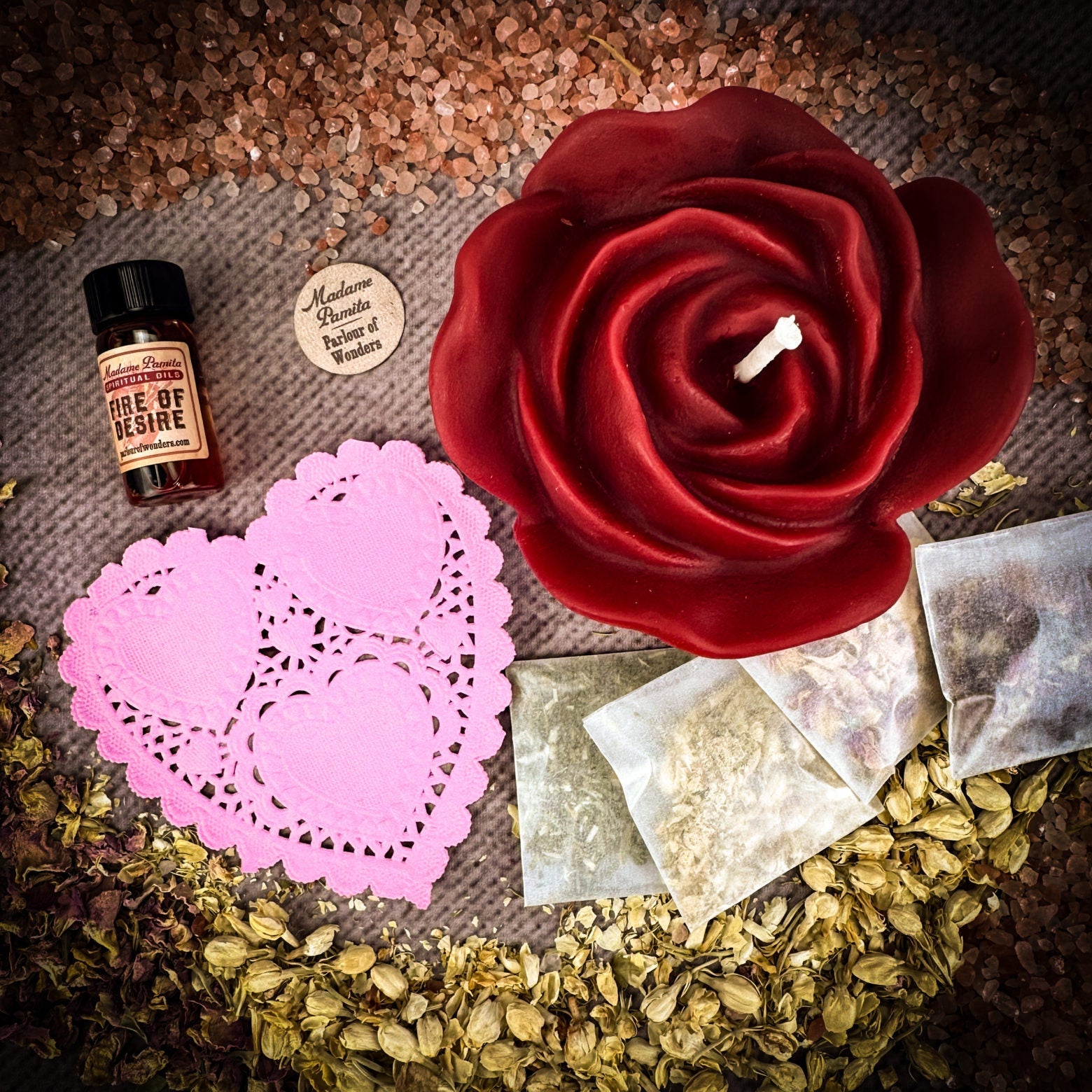 Parlour of Wonders Rose Romance Candle Spell Kit with yellow candles and love-themed accessories for romance and happiness.
