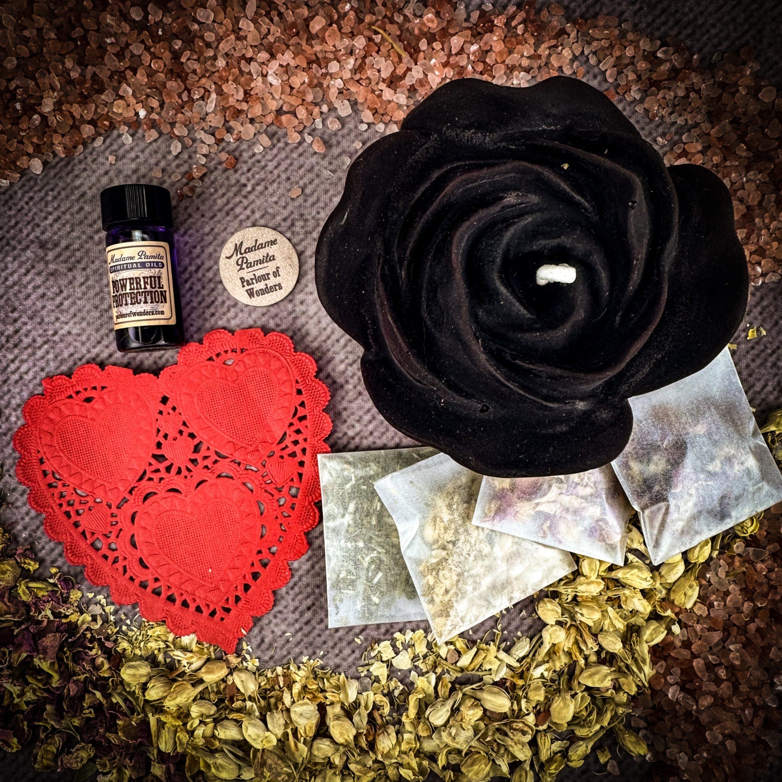 Parlour of Wonders Rose Romance Candle Spell Kit with yellow candles and love-themed symbols for romance and happiness.