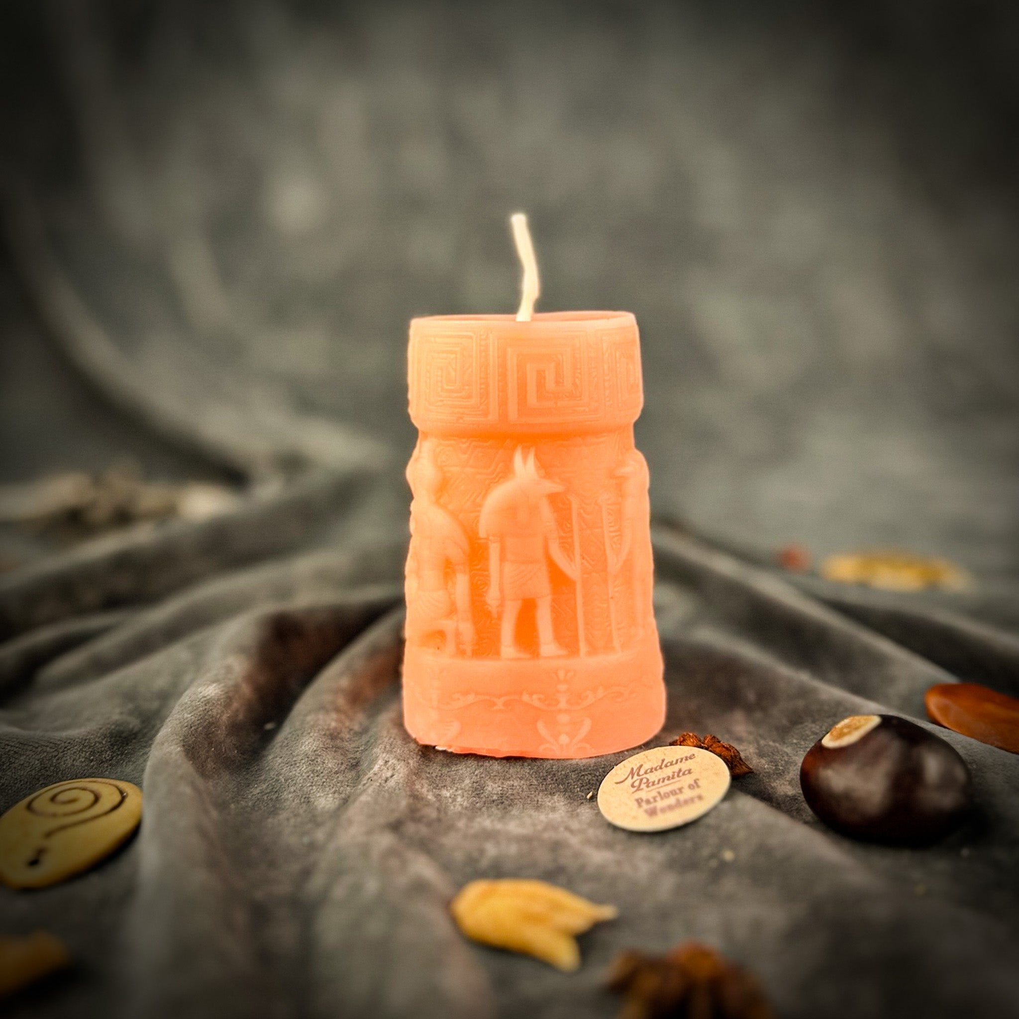 Egyptian pillar candle spell kit featuring Anubis and Horus for protection and divine guidance, with yellow candles from Parlour of Wonders.