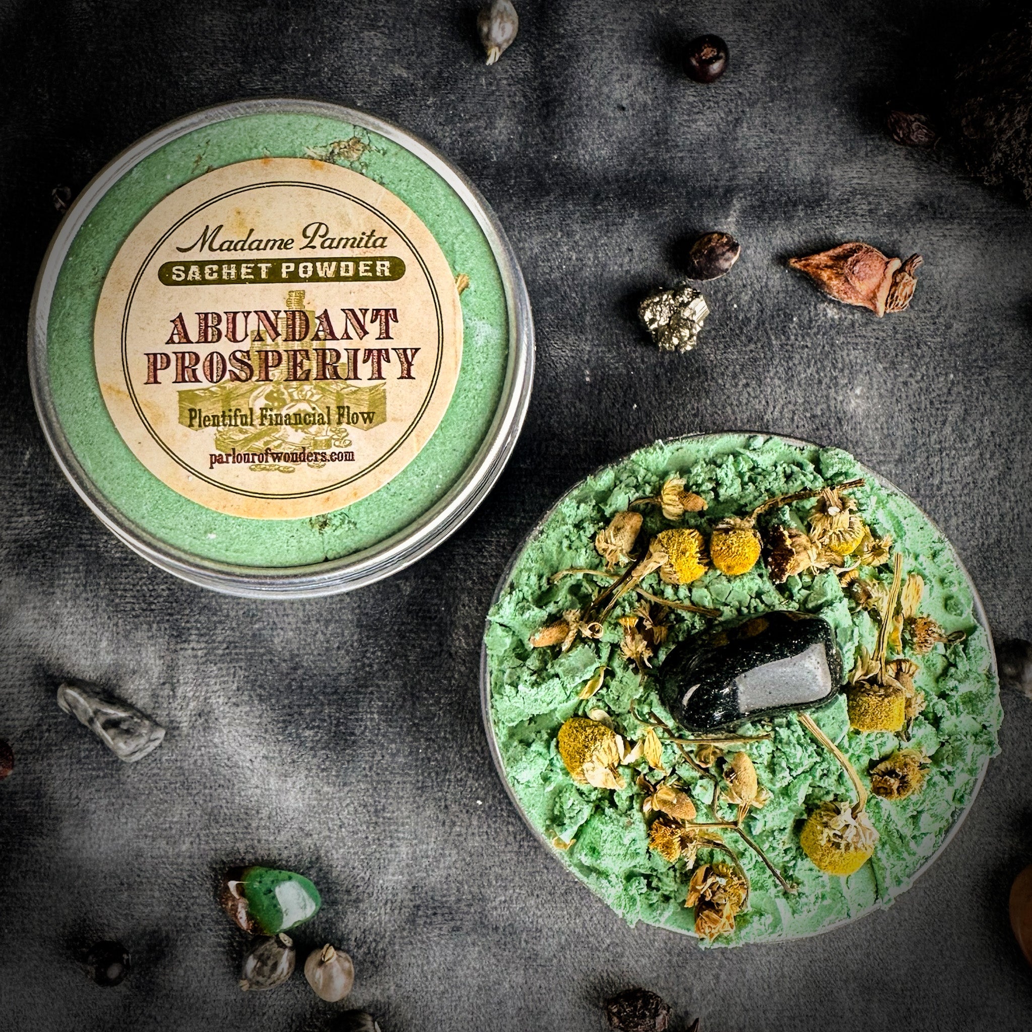 Abundant Prosperity Sachet Powder by Madame Pamita from Parlour of Wonders, shown in a small herbal powder sachet.