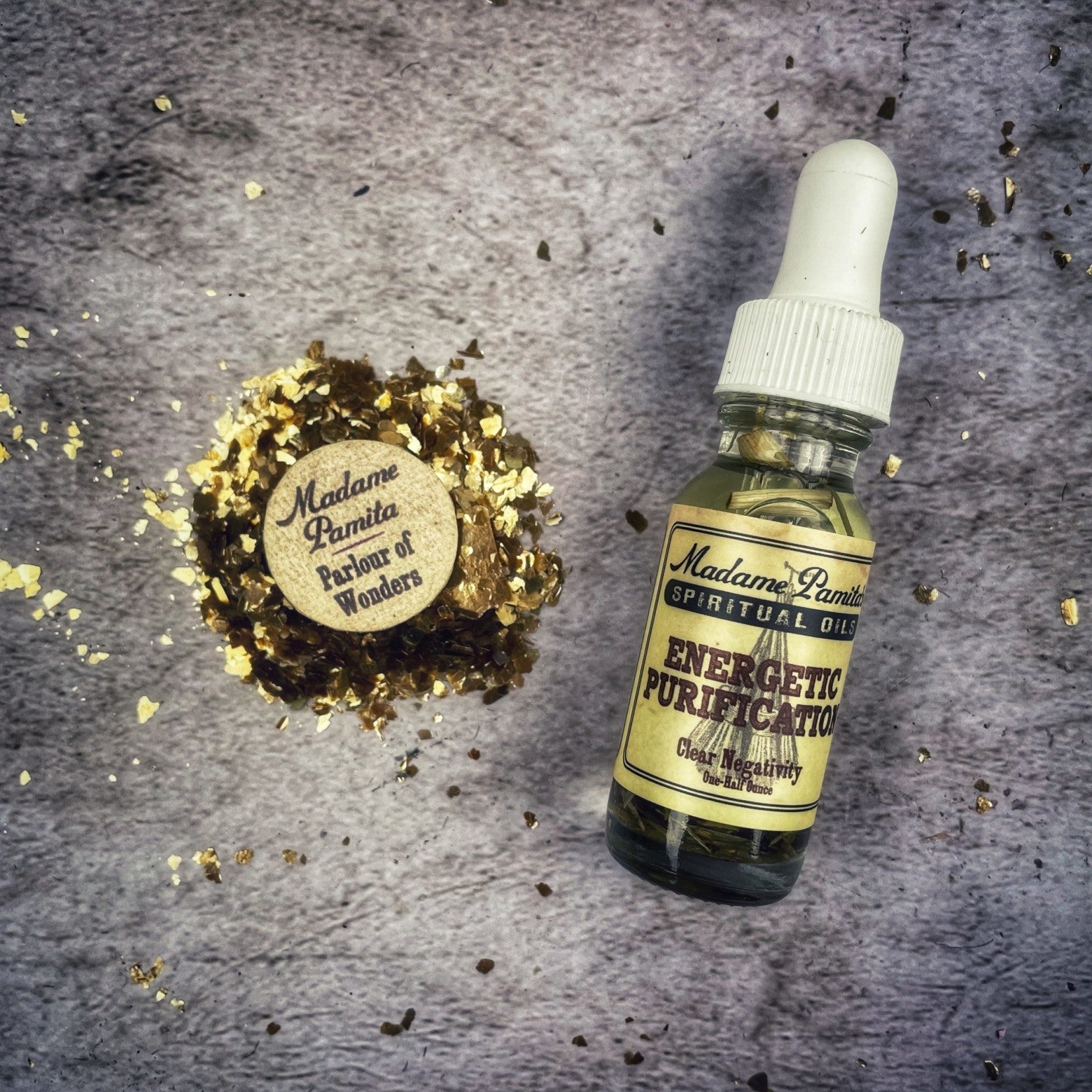 Bottle of Energetic Purification Oil by Madame Pamita from Parlour of Wonders, with herbal ingredients and a clear label.