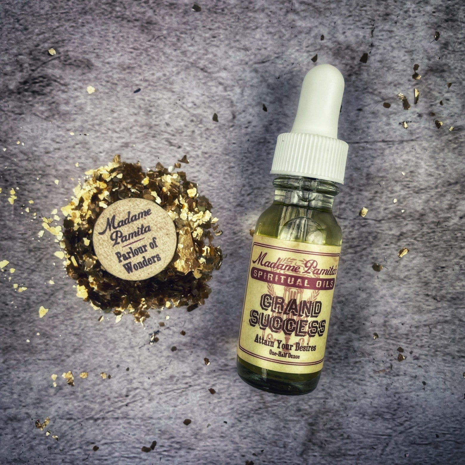 Bottle of Grand Success Oil by Madame Pamita from Parlour of Wonders, with ornate label and golden cap on a dark background.