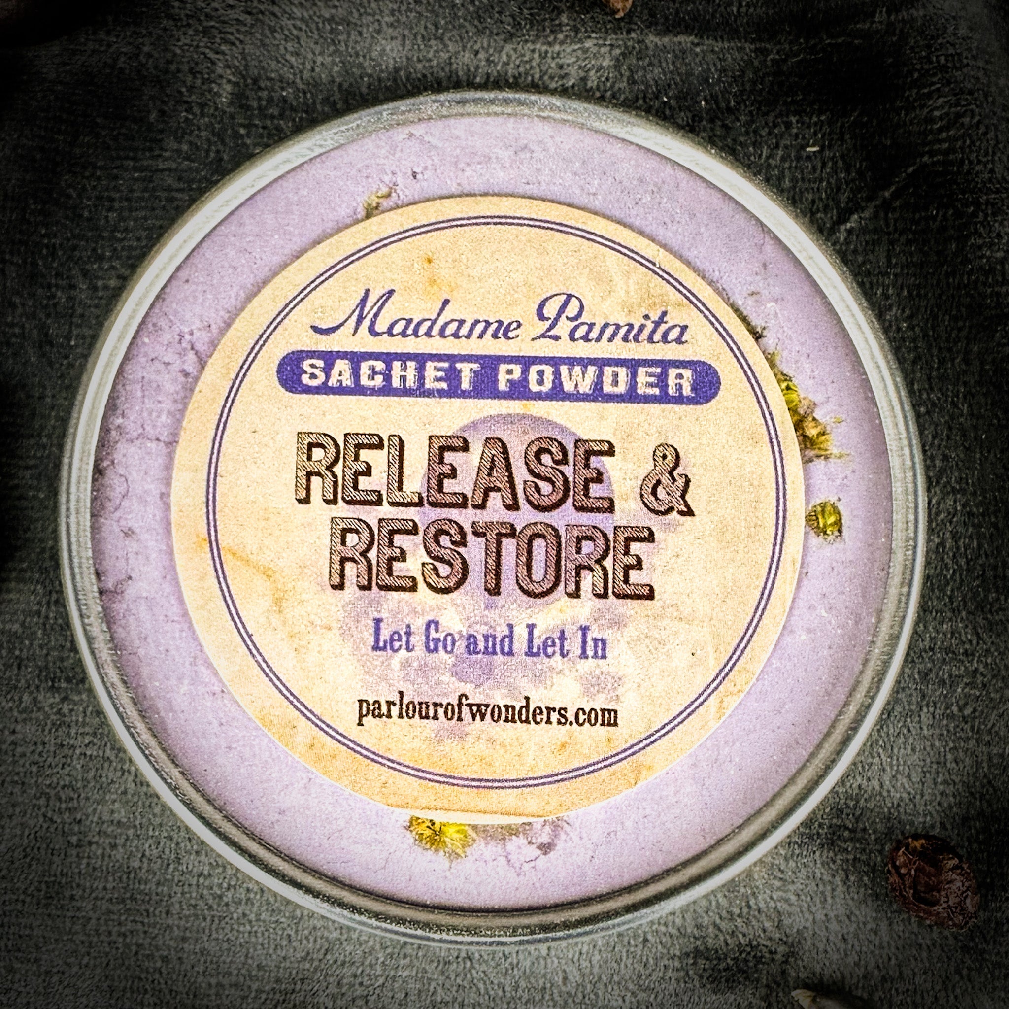 Parlour of Wonders Release and Restore Sachet Powder by Madame Pamita, featuring a small pouch with herbal and restorative ingredients.