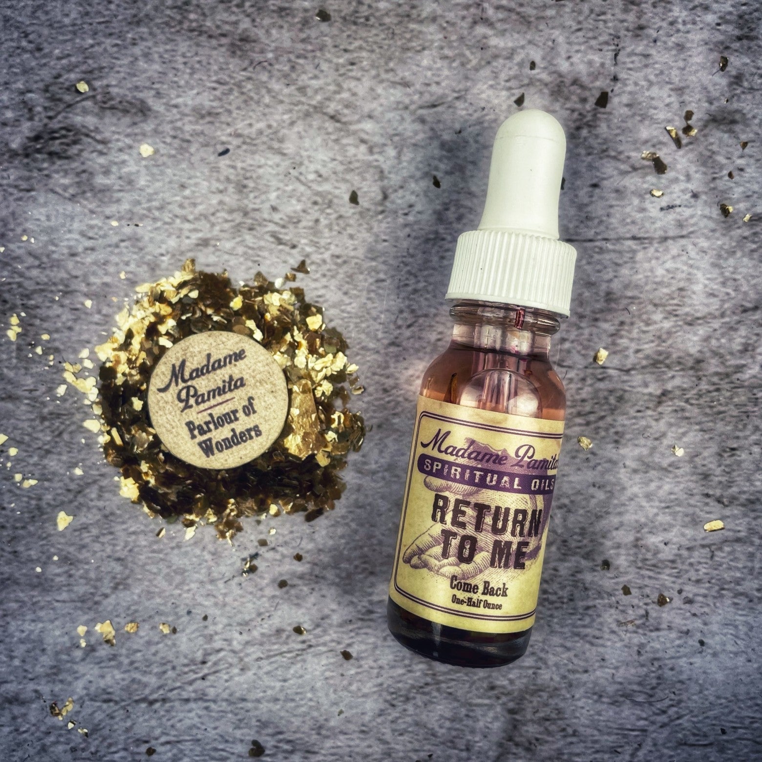 Return to Me Oil by Madame Pamita from Parlour of Wonders, featuring a small glass bottle with an ornate label and wooden cap.