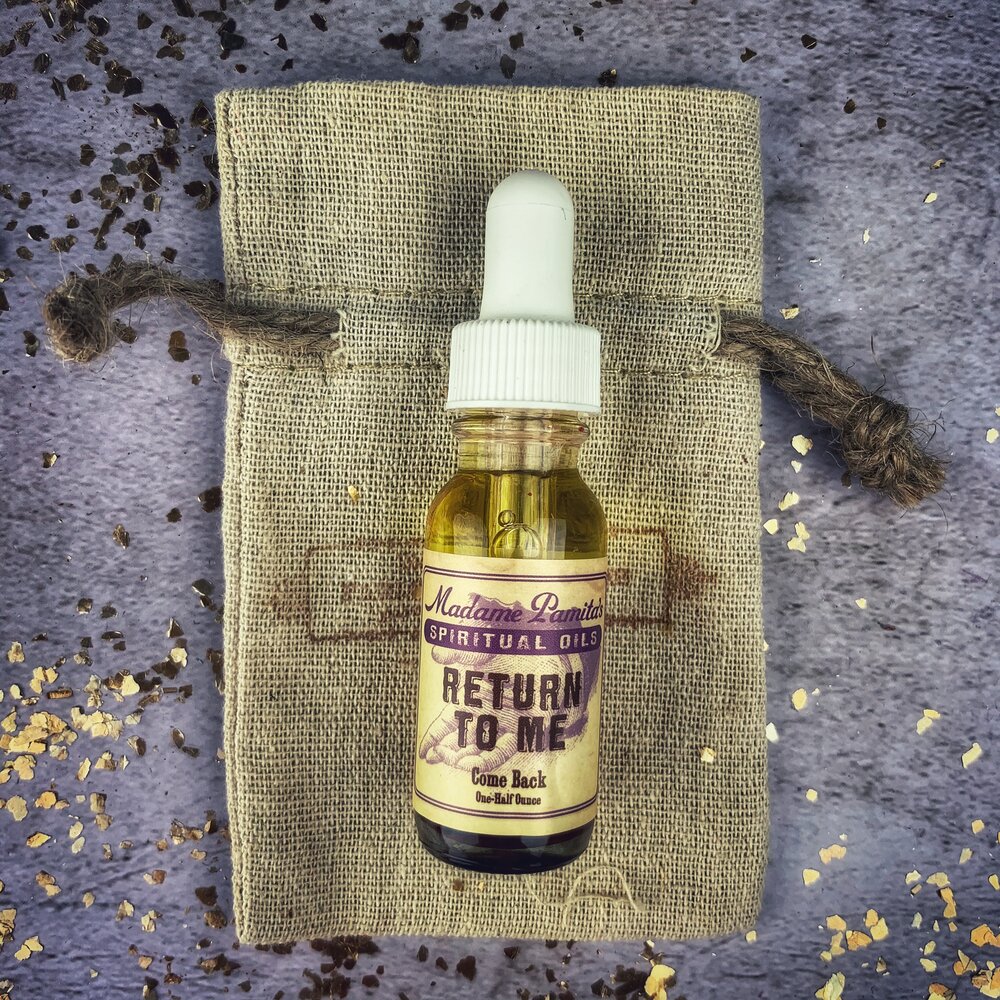 Return to Me Oil by Madame Pamita from Parlour of Wonders, featuring a dark glass bottle and mystical label design.