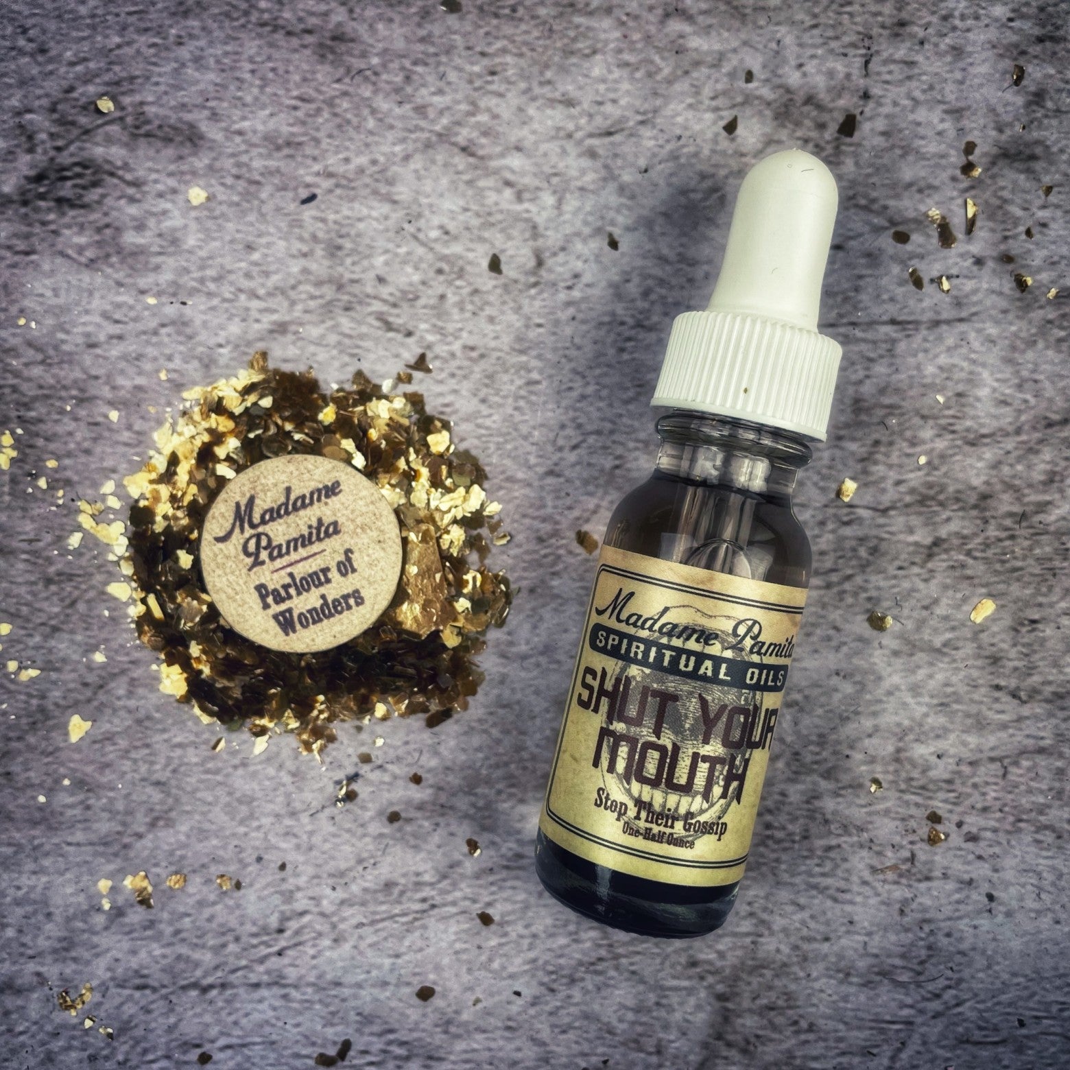 Bottle of Shut Your Mouth Oil by Madame Pamita from Parlour of Wonders, featuring a dark glass container with a dropper cap.
