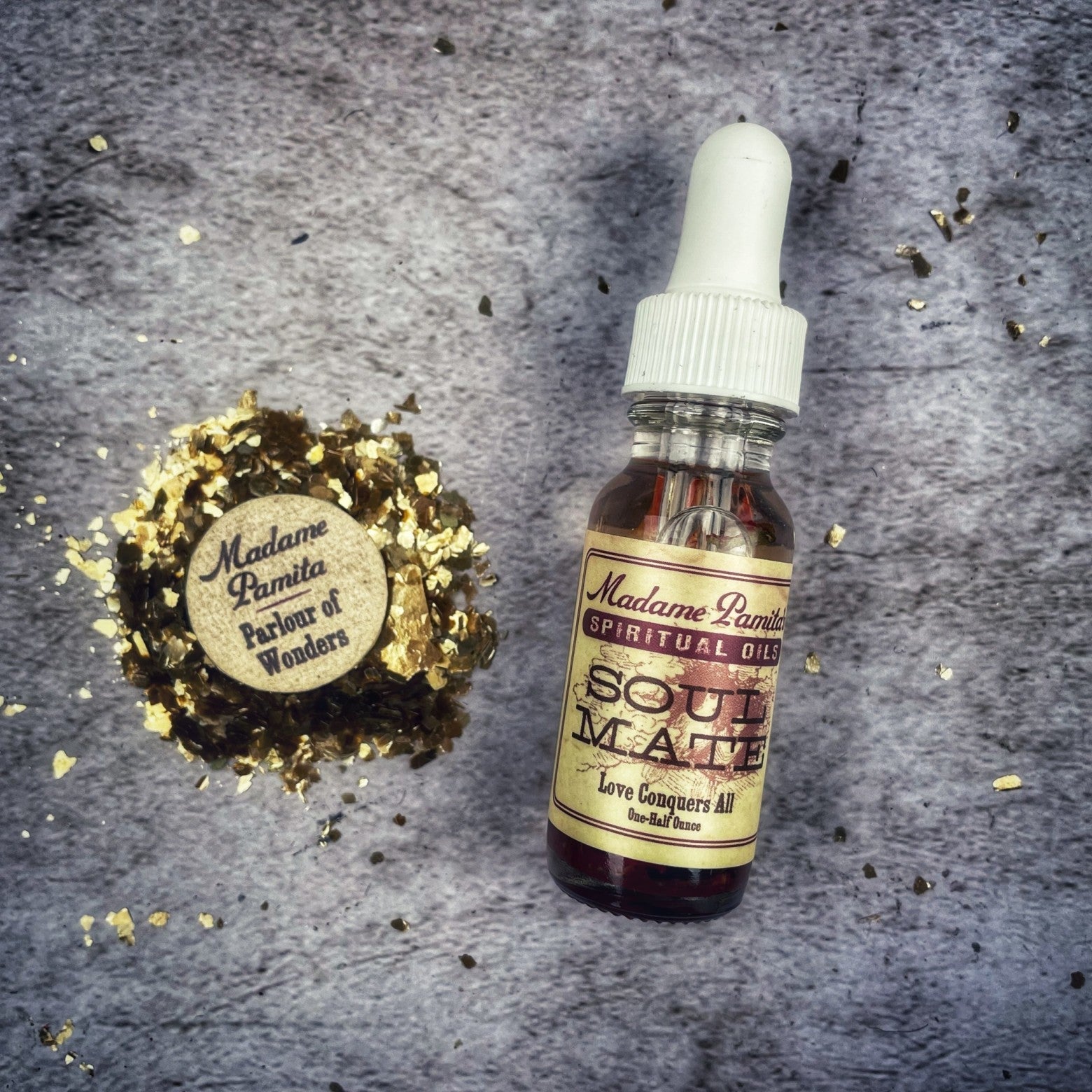 Bottle of Soul Mate Oil by Madame Pamita from Parlour of Wonders, featuring elegant packaging with mystical symbols.