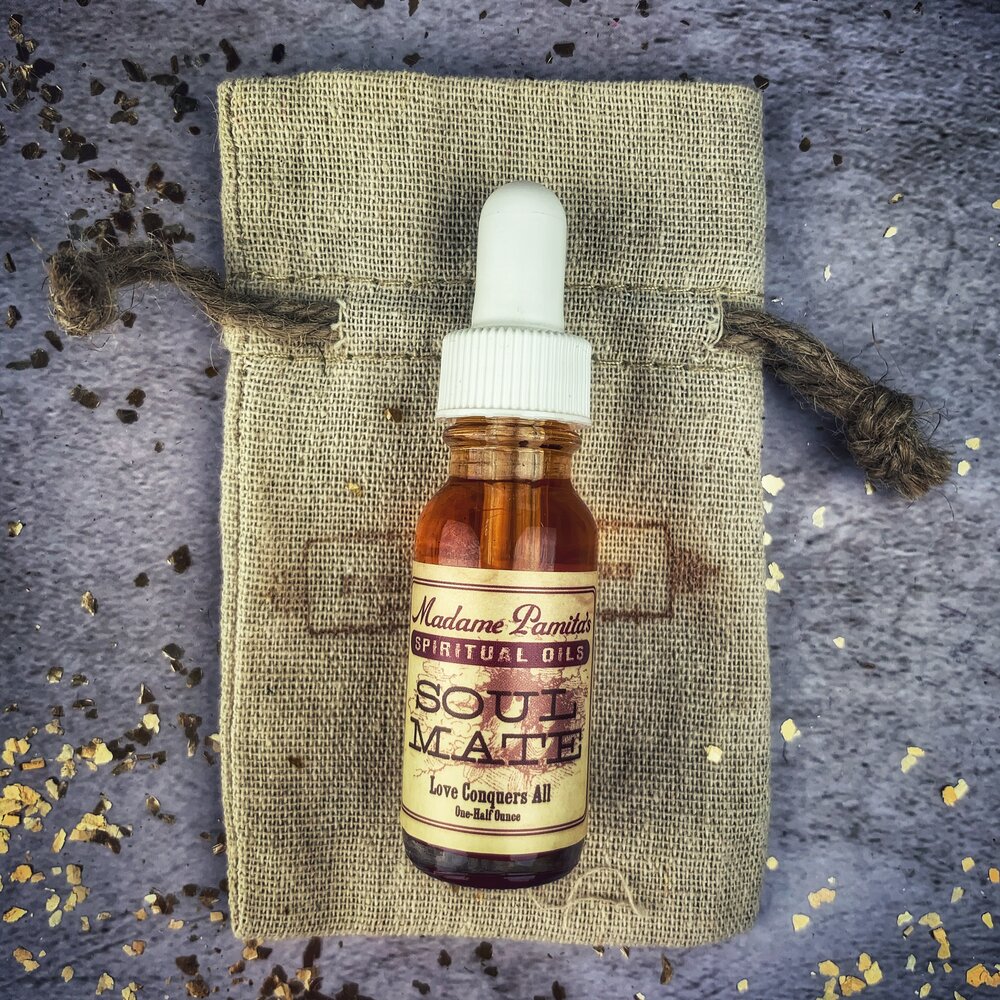Bottle of Soul Mate Oil by Madame Pamita from Parlour of Wonders, featuring the product label and dark glass container.