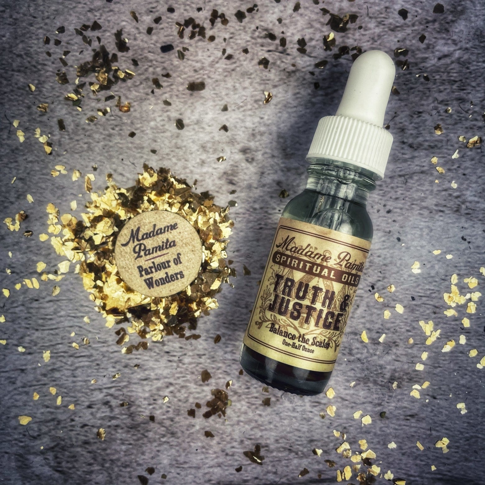 Bottle of Truth and Justice Oil by Madame Pamita from Parlour of Wonders, with label and clear glass container visible.
