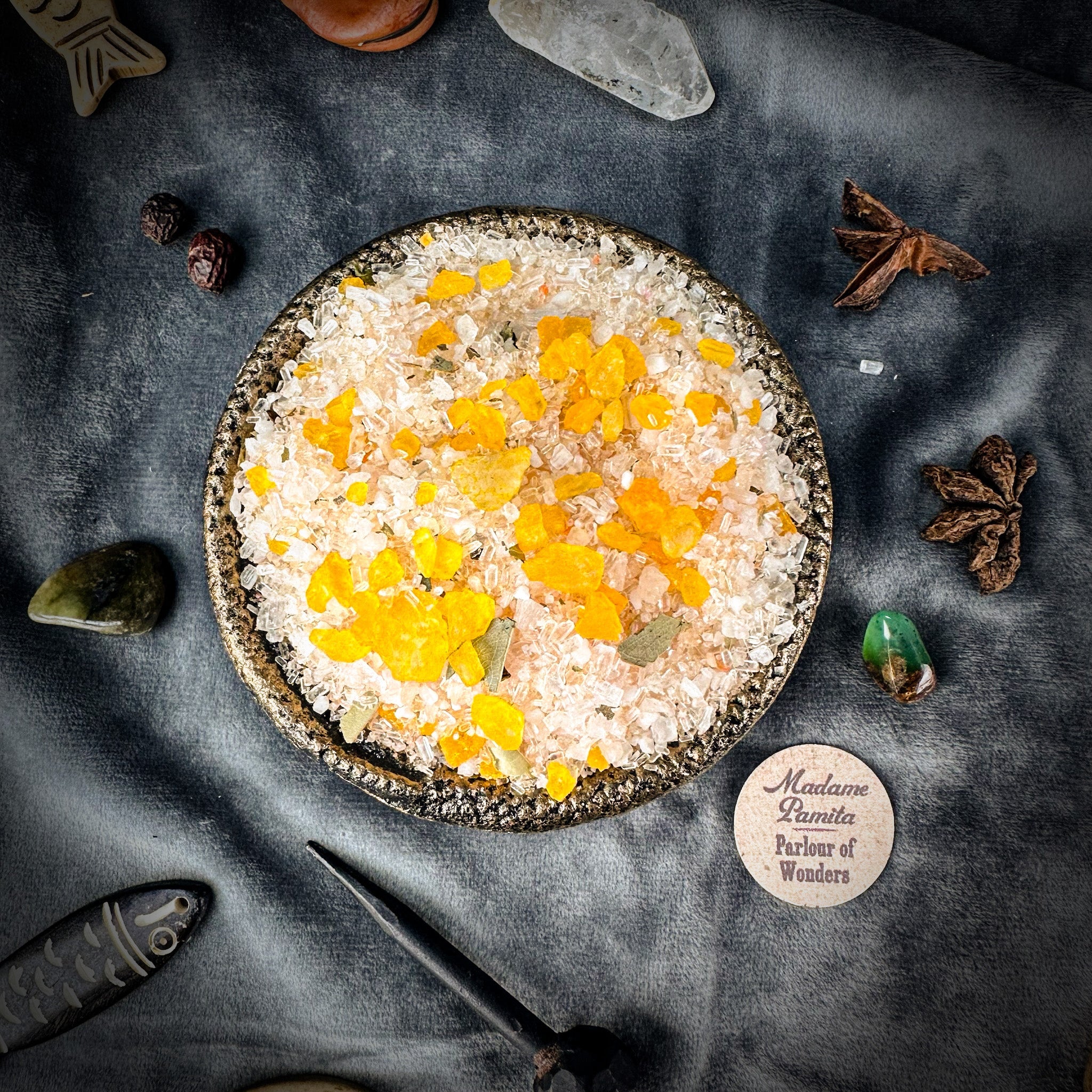 Small jar of Parlour of Wonders Block Buster Bath Crystals with colorful crystals for relaxing bath experience.