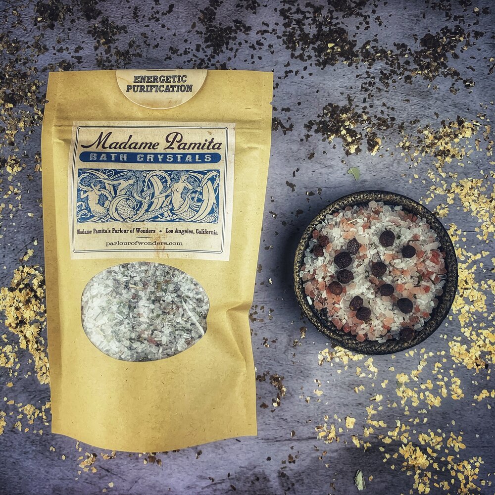 Small jar of Parlour of Wonders Energetic Purification Bath Crystals with colorful crystals and natural packaging.