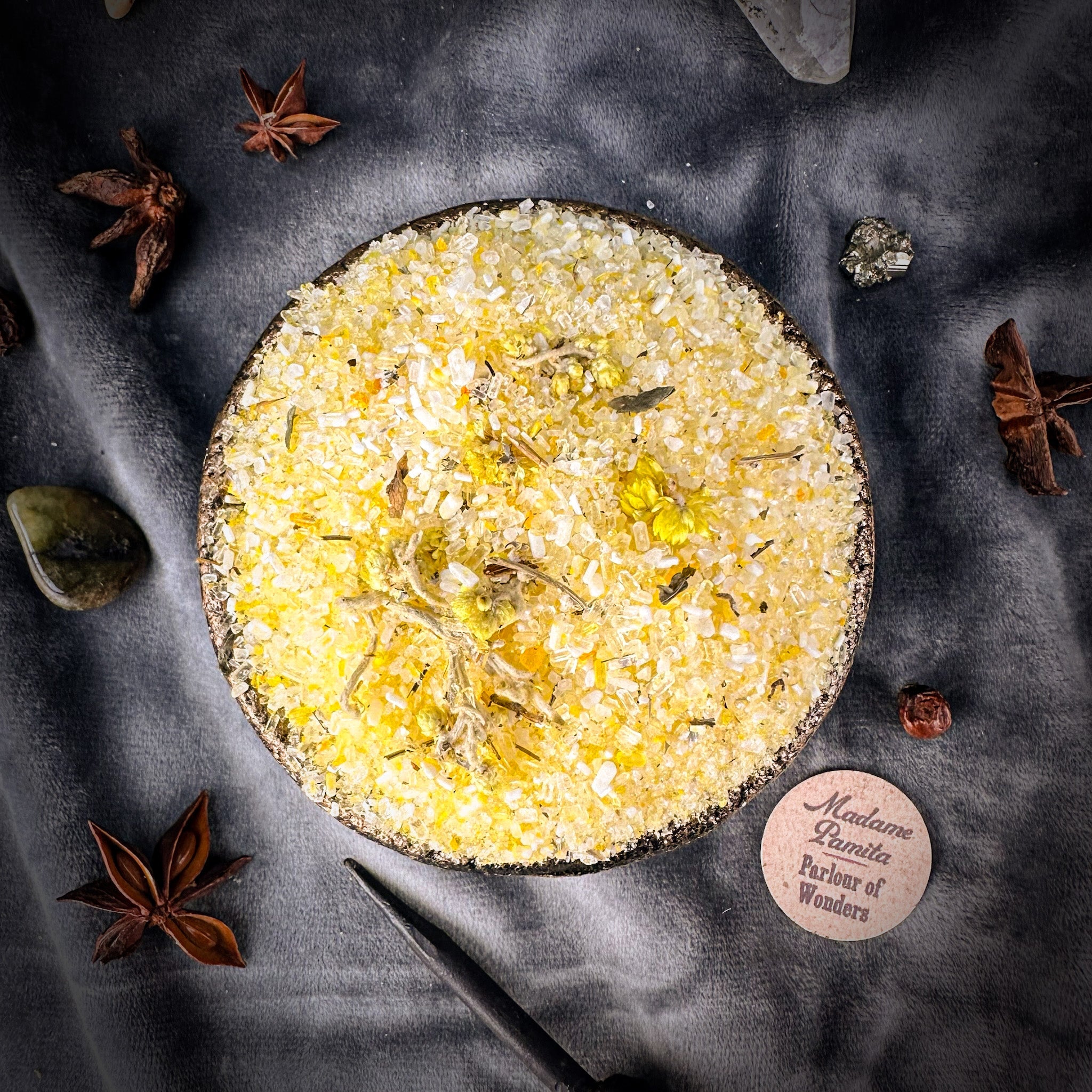 Small jar of Parlour of Wonders Grand Success Bath Crystals with colorful crystals and a decorative label, ideal for relaxing baths.