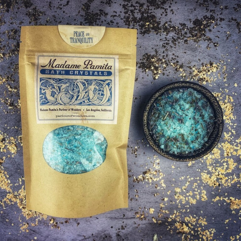 Small jar of Parlour of Wonders Peace and Tranquility Bath Crystals with colorful crystals inside, ideal for relaxing bath sessions.