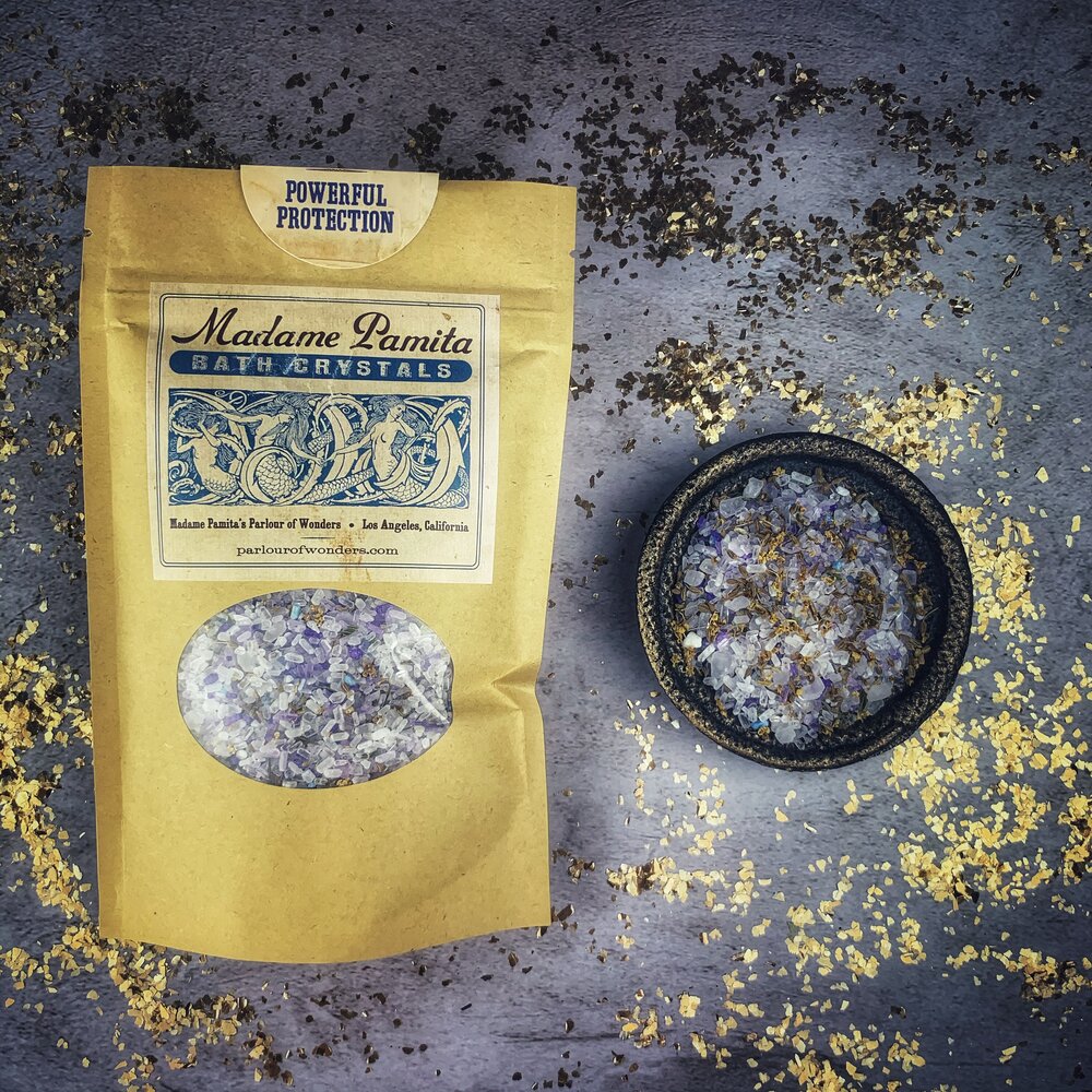 Small jar of Parlour of Wonders Powerful Protection Bath Crystals with herbal and mineral ingredients for a soothing bath experience.