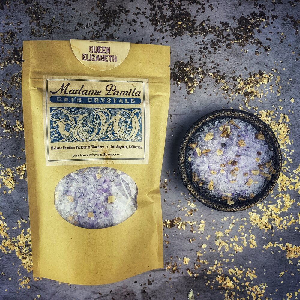 Small jar of Parlour of Wonders Queen Elizabeth Bath Crystals with colorful crystals and elegant packaging.