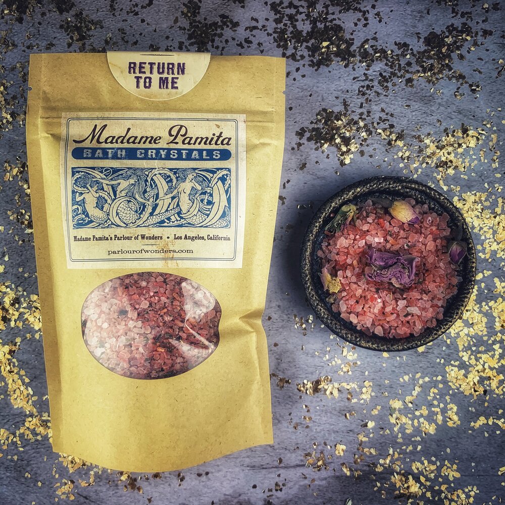 Parlour of Wonders Return to Me Bath Crystals in a glass jar, showcasing the herbal and floral bath salts for a relaxing soak.