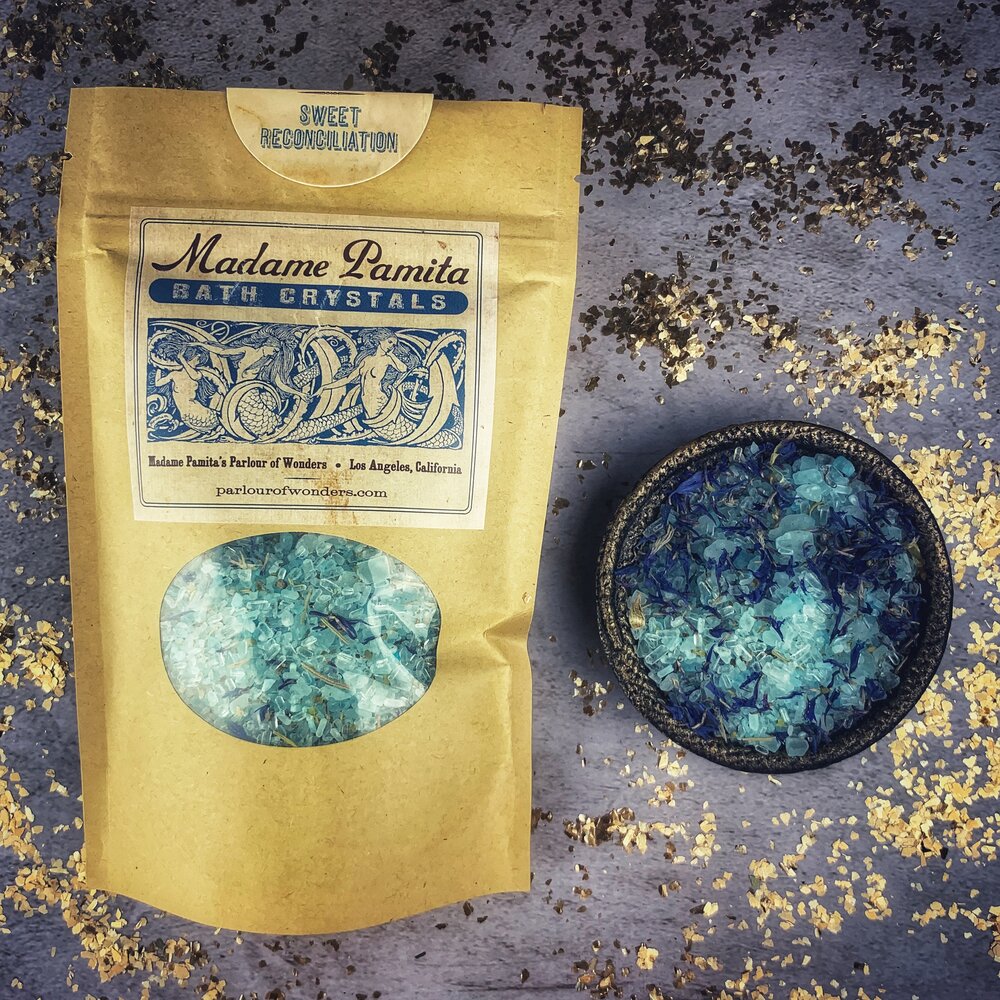 Small jar of Parlour of Wonders Sweet Reconciliation Bath Crystals with pink and white crystals, designed for relaxing bath experiences.