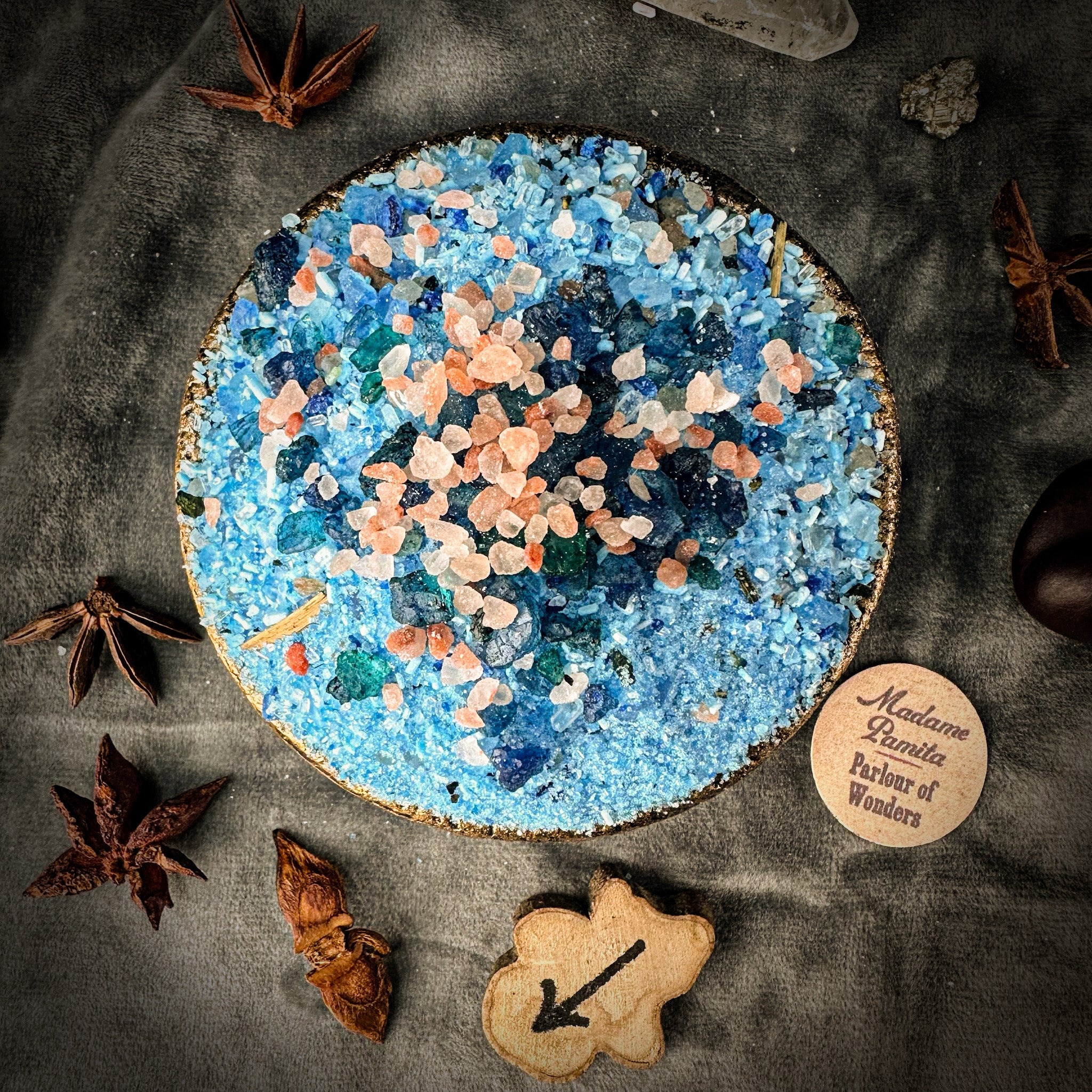 Small jar of Parlour of Wonders Talk to Me Bath Crystals with colorful crystals inside for a relaxing bath experience.