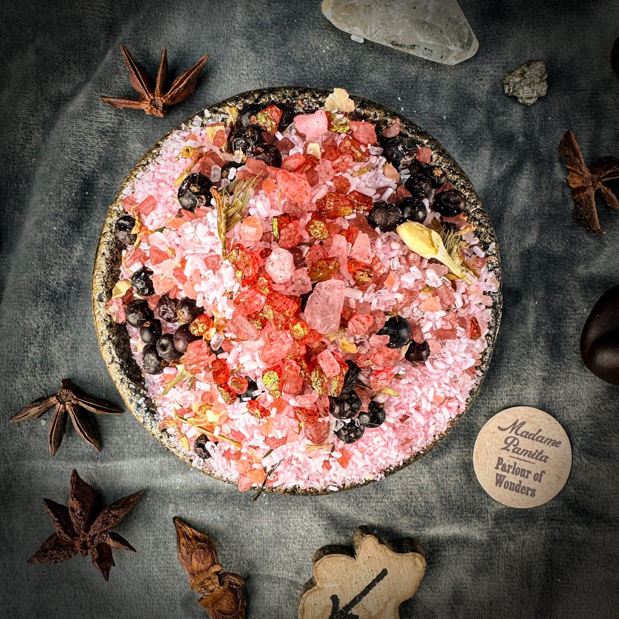 Small jar of Parlour of Wonders True Love Bath Crystals with pink and white crystals in a clear glass container.