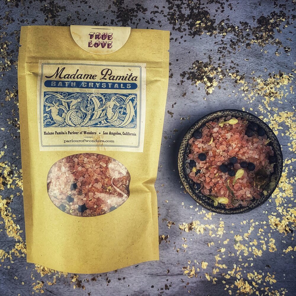 Small jar of Parlour of Wonders True Love Bath Crystals with pink and white crystals, perfect for relaxing baths.