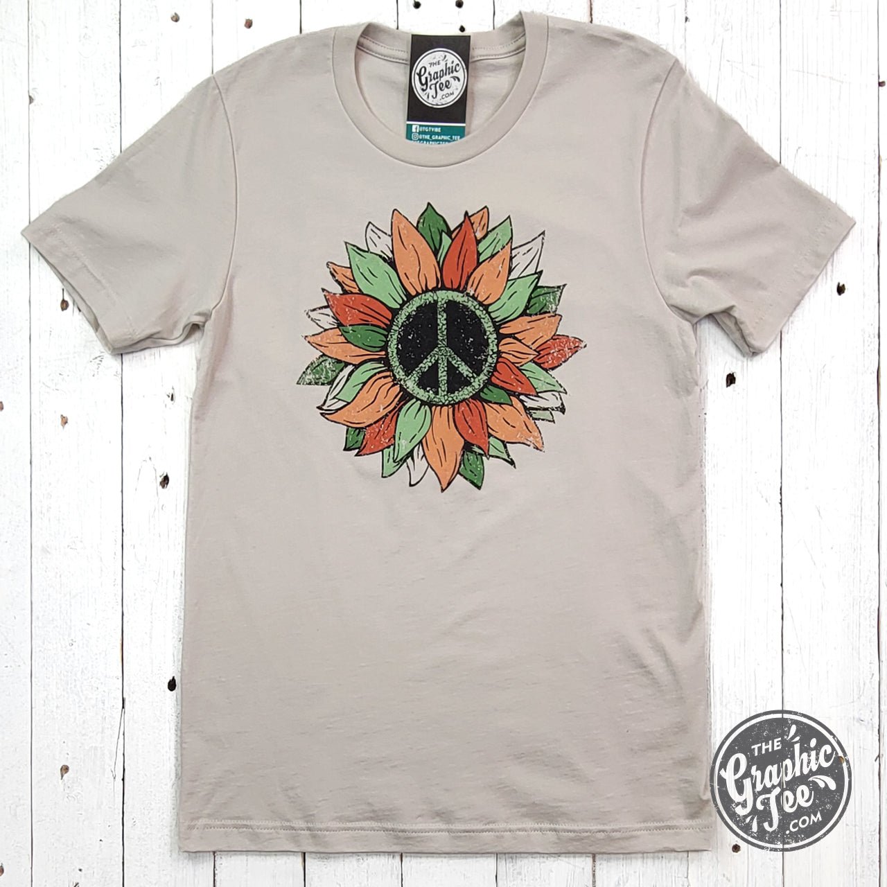 Peace sunflower short sleeve graphic tee from The Graphic Tee, featuring a vibrant sunflower design on soft fabric.