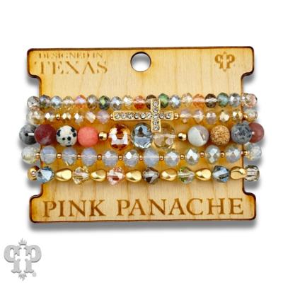 Pink Panache Brands faceted bead multi-strand bracelet stack with rhinestone cross, featuring blue beads and layered design.