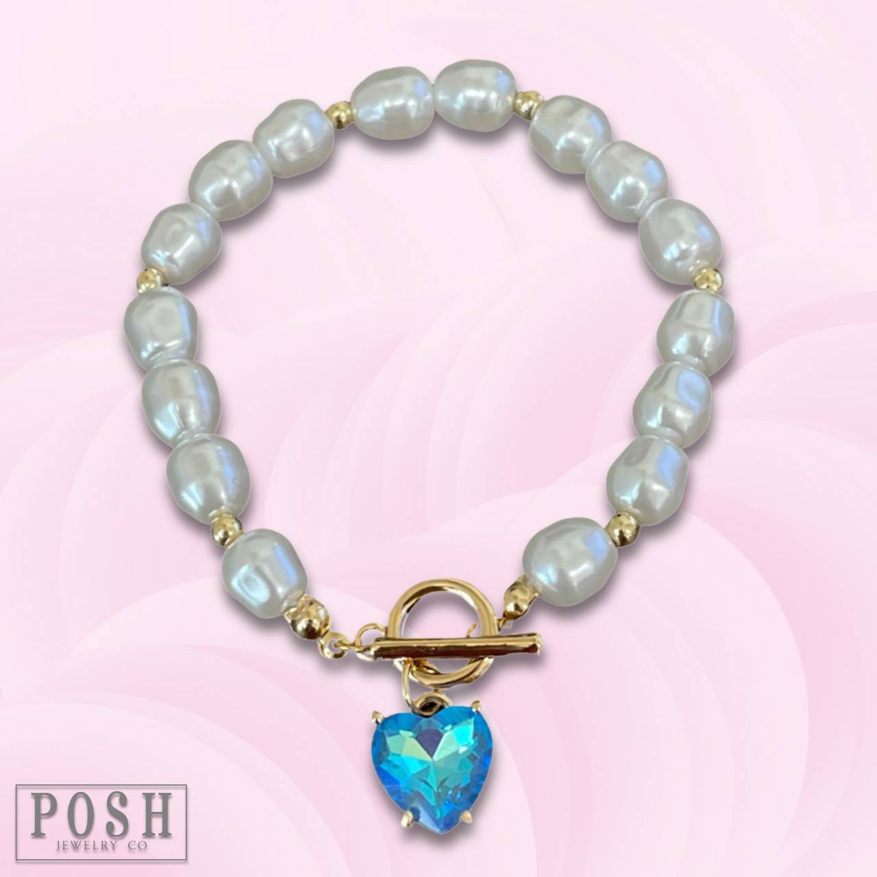 Pink Panache Brands blue pearl bracelet with a heart charm, featuring elegant beads and a delicate jewelry design.