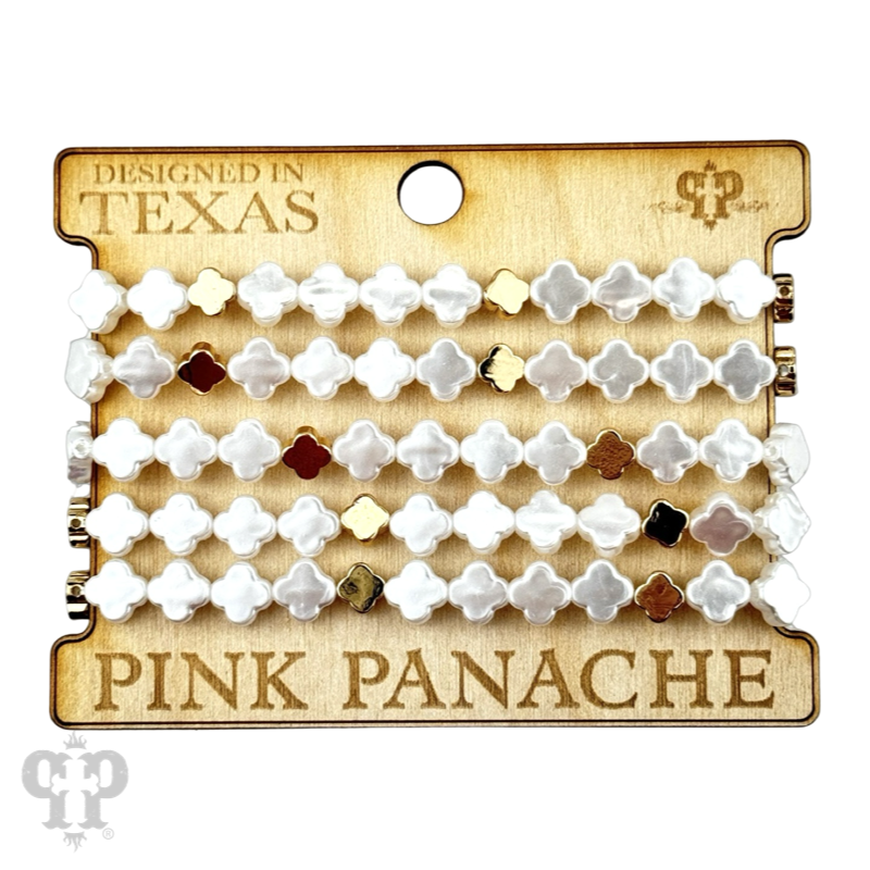 Iridescent pearl clover-shaped bracelet stack from Pink Panache Brands, featuring gold-tone jewelry with shimmering pearls and floral accents.