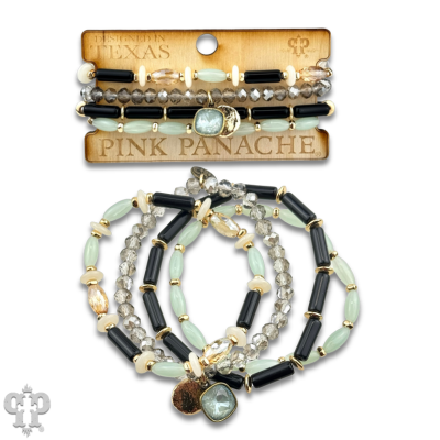 Stack of pink and green beaded bracelets with Austrian crystal charms from Pink Panache Brands, featuring mixed bead designs.