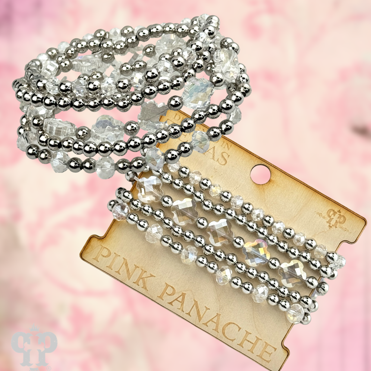 Set of pink Panache Brands crystal and silver bead bracelets, showcasing elegant silver and pink crystal beads in a stylish jewelry set.