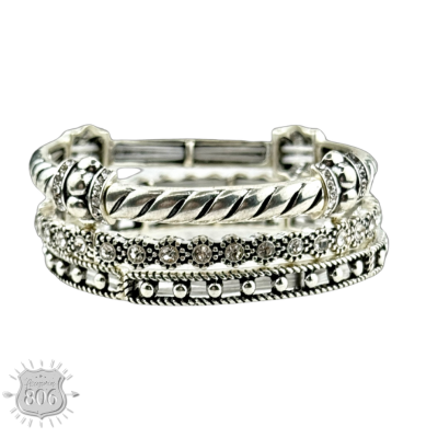 Three-piece rhinestone and silver bracelet set from Pink Panache Brands, featuring sparkling embellishments and elegant designs.