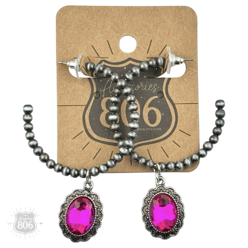 Silver Navajo style bead hoop earring with oval rhinestone charm from Pink Panache Brands, close-up view of jewelry details.