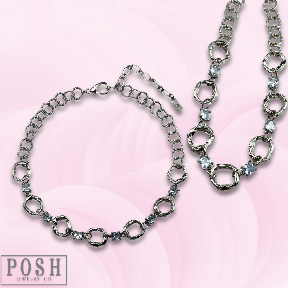 Silver chain necklace with square rhinestone accents from Pink Panache Brands, showcasing a stylish and sparkling jewelry piece.