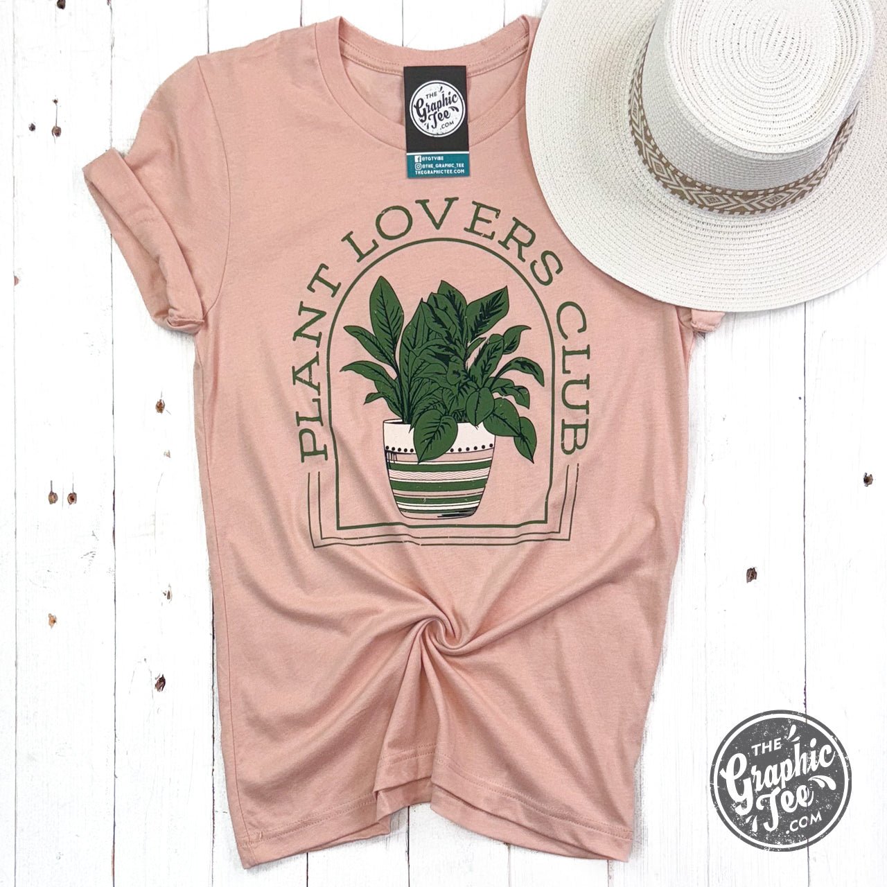 Heather peach Plant Lovers Club graphic short sleeve crewneck tee by The Graphic Tee, featuring plant-inspired design on soft fabric.