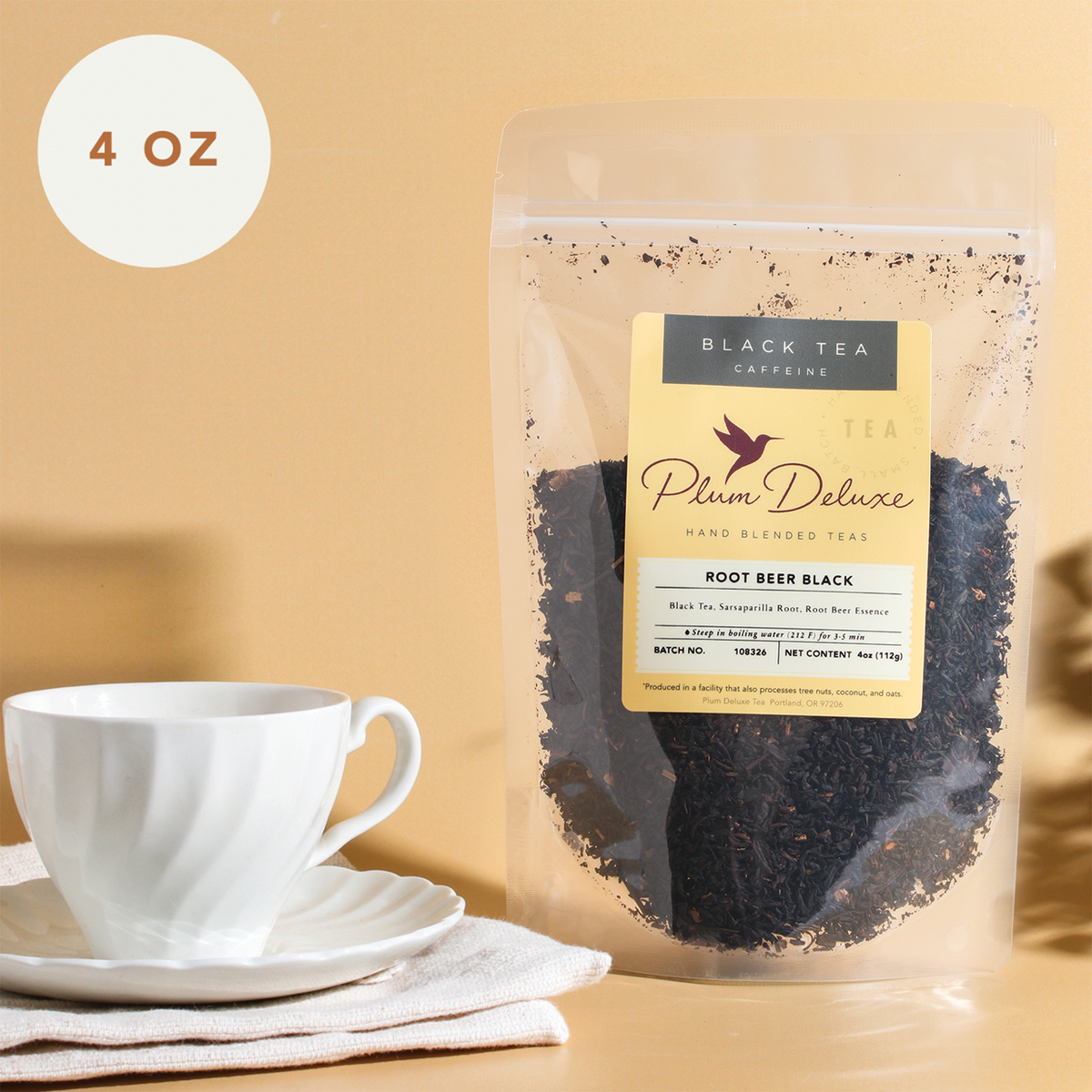 A 4 oz package of Plum Deluxe Tea Root Beer Black Tea, featuring a resealable bag with a label displaying the tea's flavor.