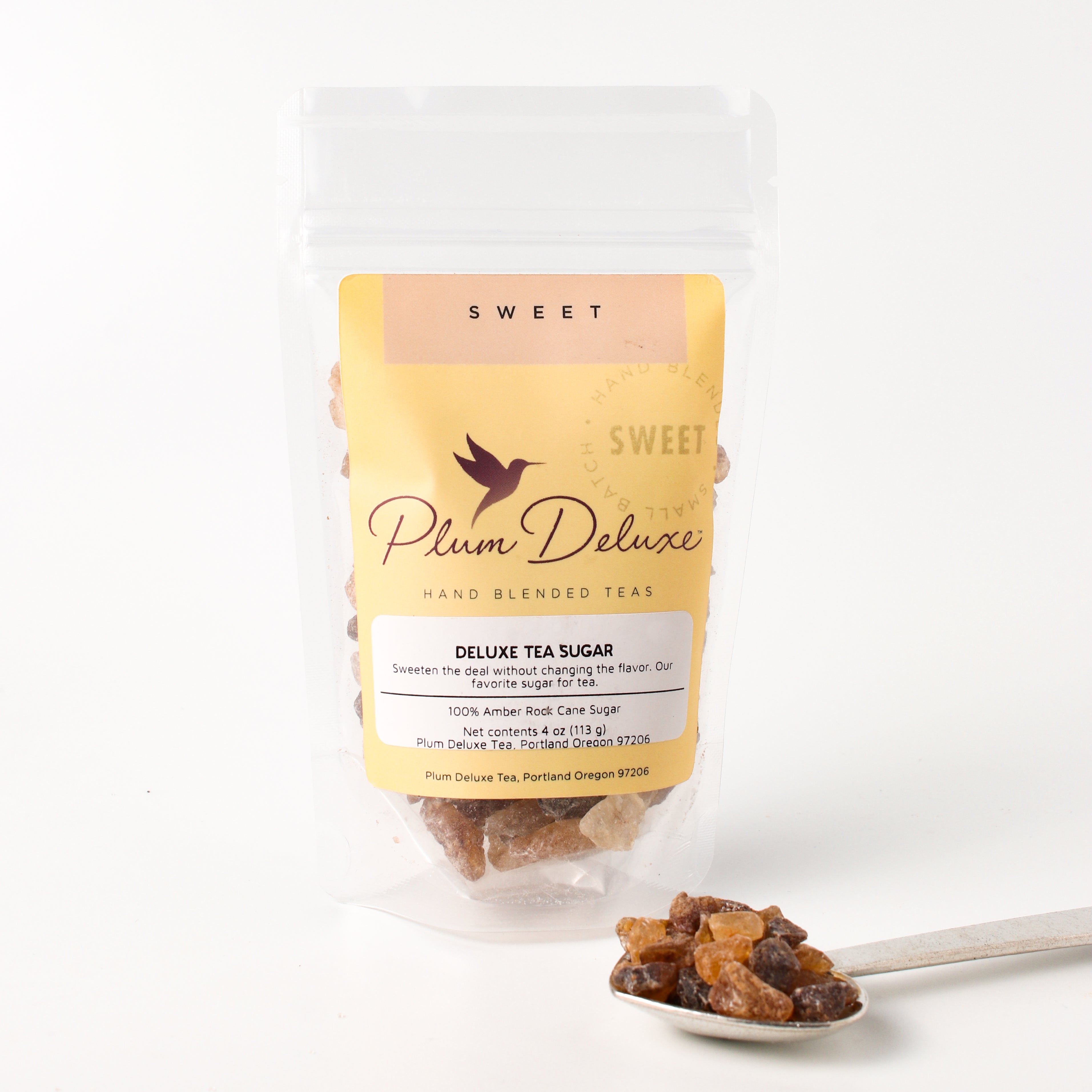 Plum Deluxe Tea Deluxe Rock Sugar for Tea in a 4 oz jar, natural crystalline sugar used to sweeten and enhance tea flavors.
