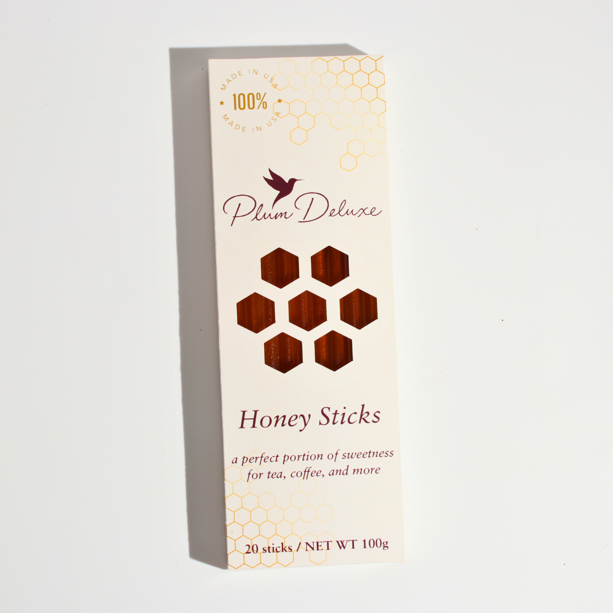Amber Carrot Blossom Honey Sticks for Tea by Plum Deluxe Tea, natural honey sticks ideal for sweetening tea drinks.