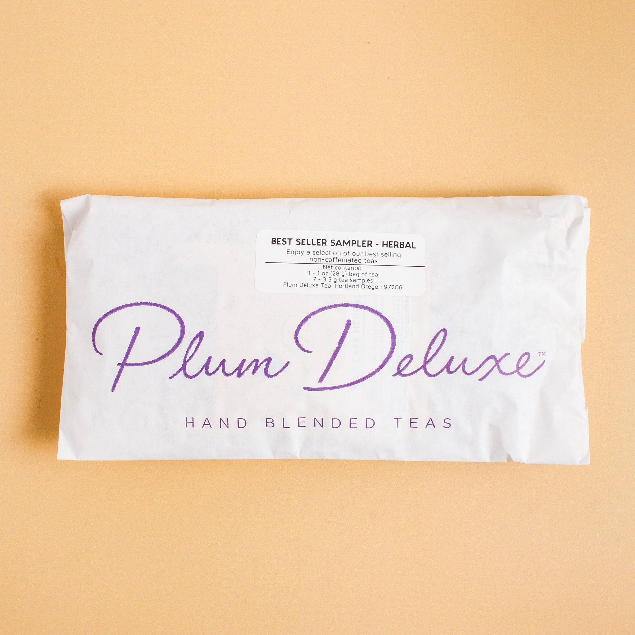 Assorted Plum Deluxe Tea best sellers sampler set with various caffeinated tea flavors in colorful packaging.