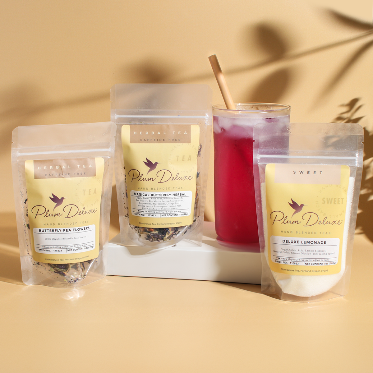 Butterfly Pea Sampler Kit by Plum Deluxe Tea showing assorted tea samples in a colorful box.