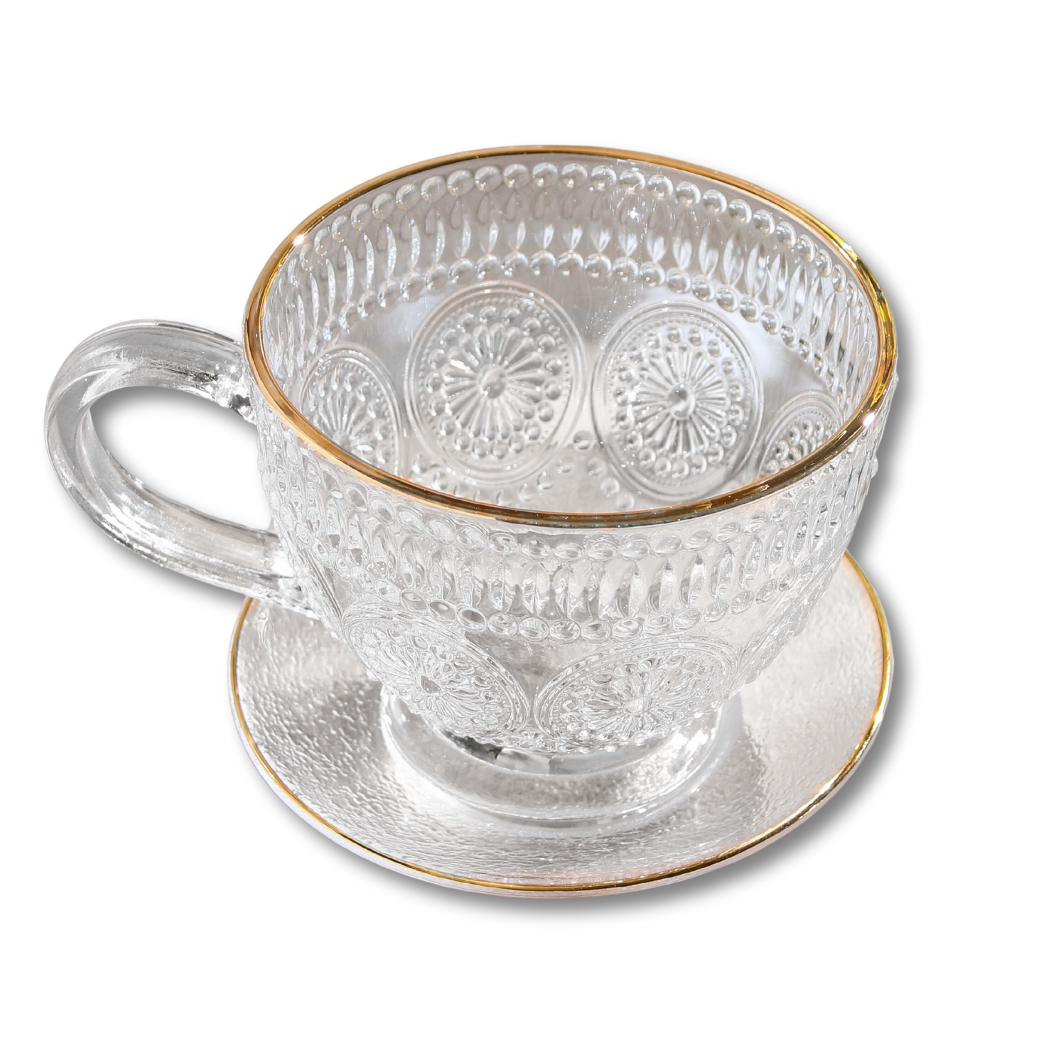 Clear glass teacup and saucer from Plum Deluxe Tea's Café Society collection, showcasing elegant design and transparent material.