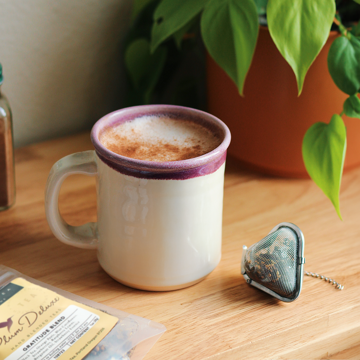 Heart-shaped tea infuser from Plum Deluxe Tea with fine mesh for brewing loose leaf tea.