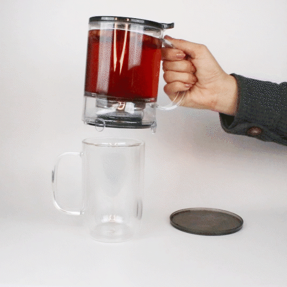 Elegant Plum Deluxe Perfect Tea Maker with glass infuser for brewing loose leaf tea, showcasing a sleek design and tea preparation process.
