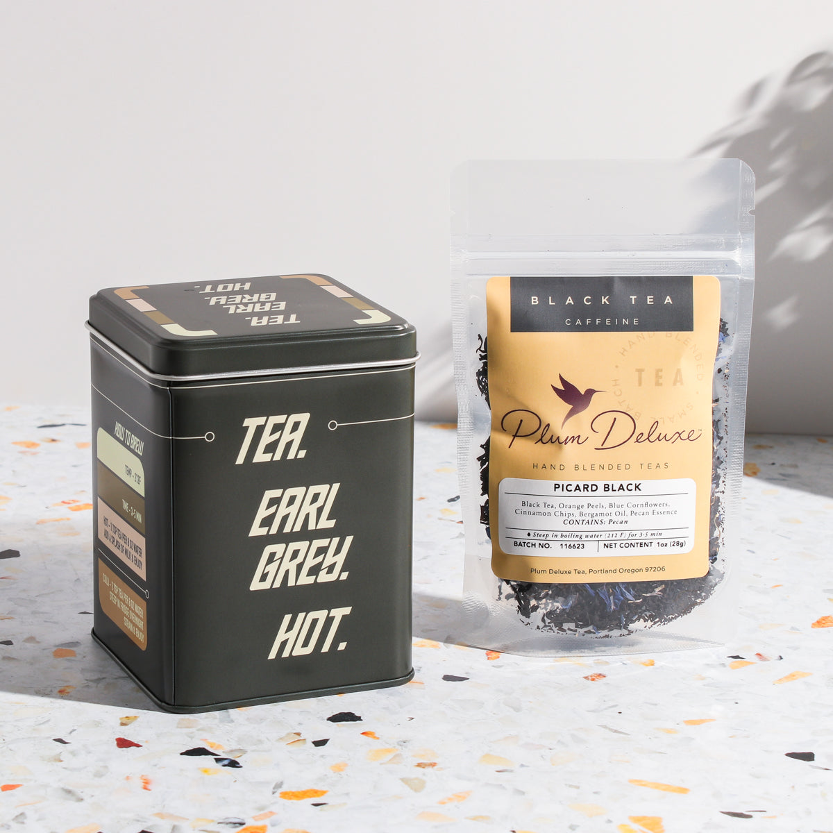 Plum Deluxe Tea Picard Black Tea Blend with Pecan and Earl Grey flavors in a tea package.
